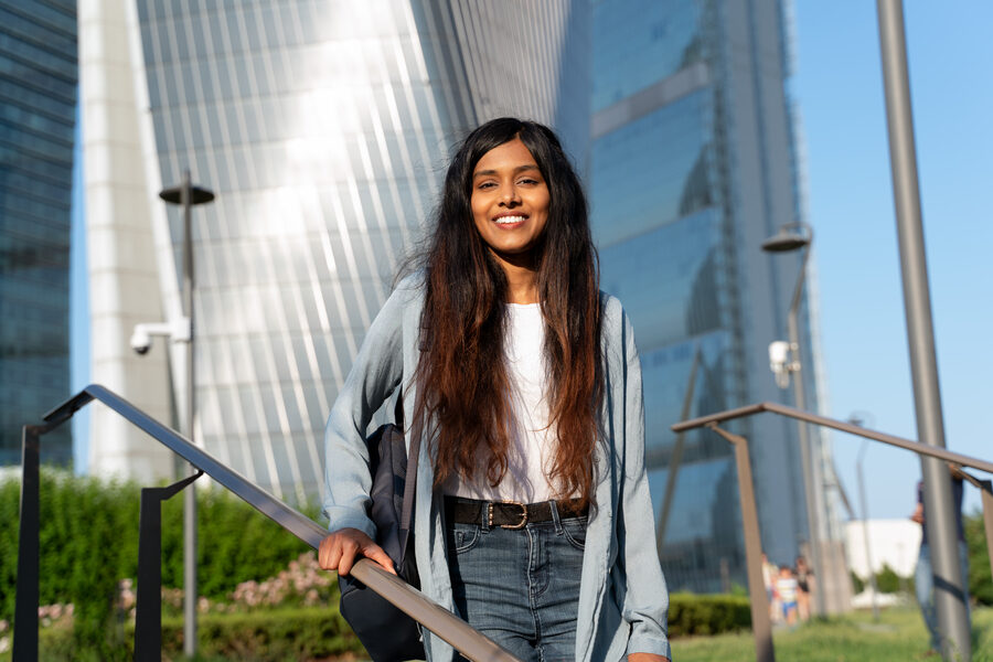 smiling-indian-student-with-backpack-walking-in-mo-2025-02-20-09-41-15-utc (1)